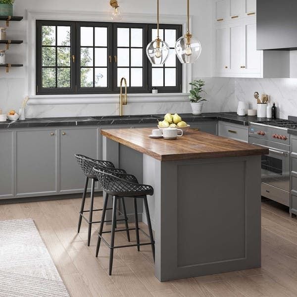 A mixture of counter surfaces in a gray kitchen