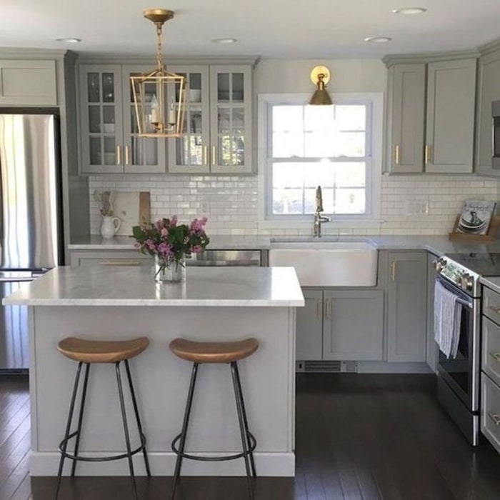 Country Style Grey Cabinets With A White Farmhouse Sink